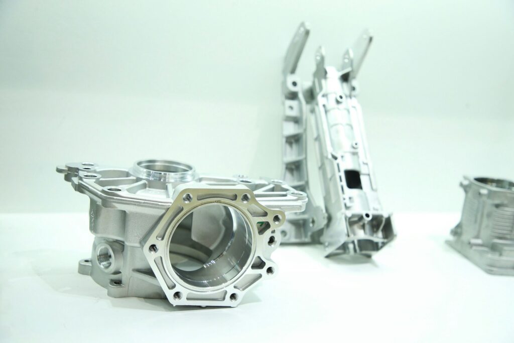 Aluminium and zinc die cast metal parts sitting on a table