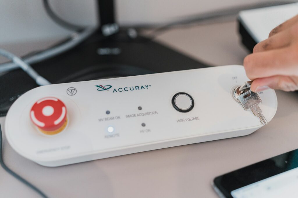 White rectangular device with a red circle, similar to a call button unit